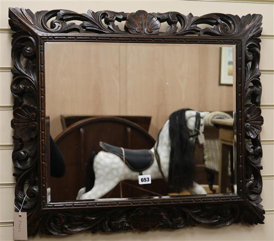 A carved oak frame mirror, W.70cm